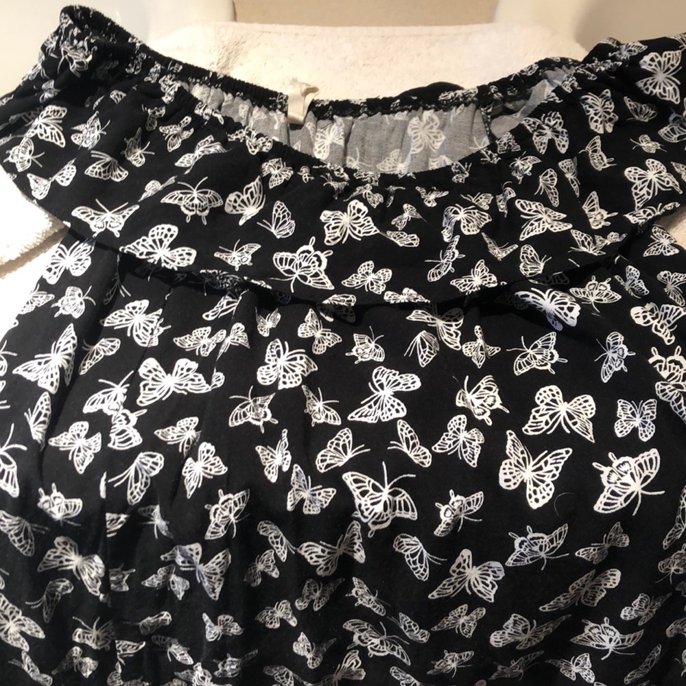 A black butterfly dress